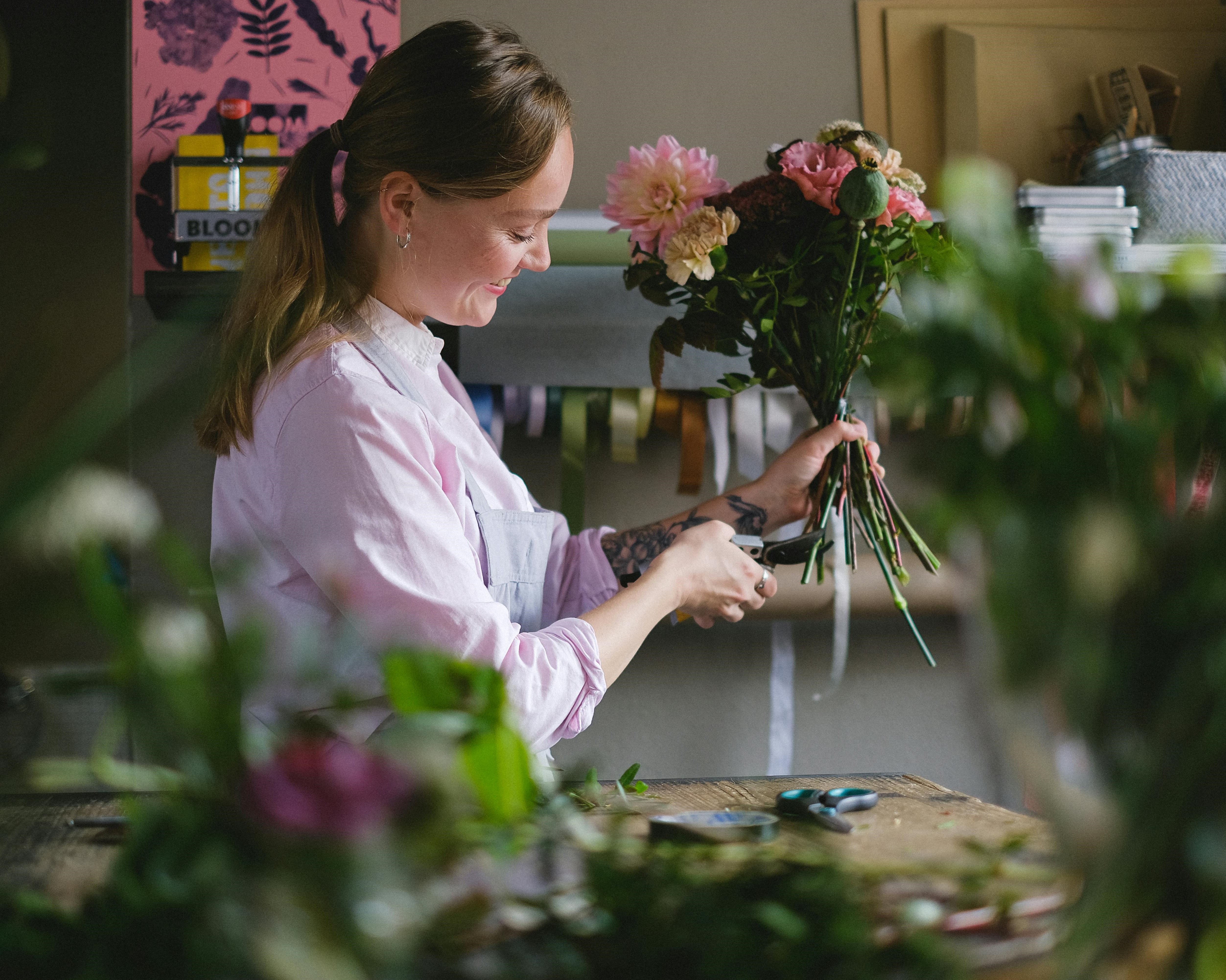 Smiling florist with bouquet - Anna Shvets, Pexels