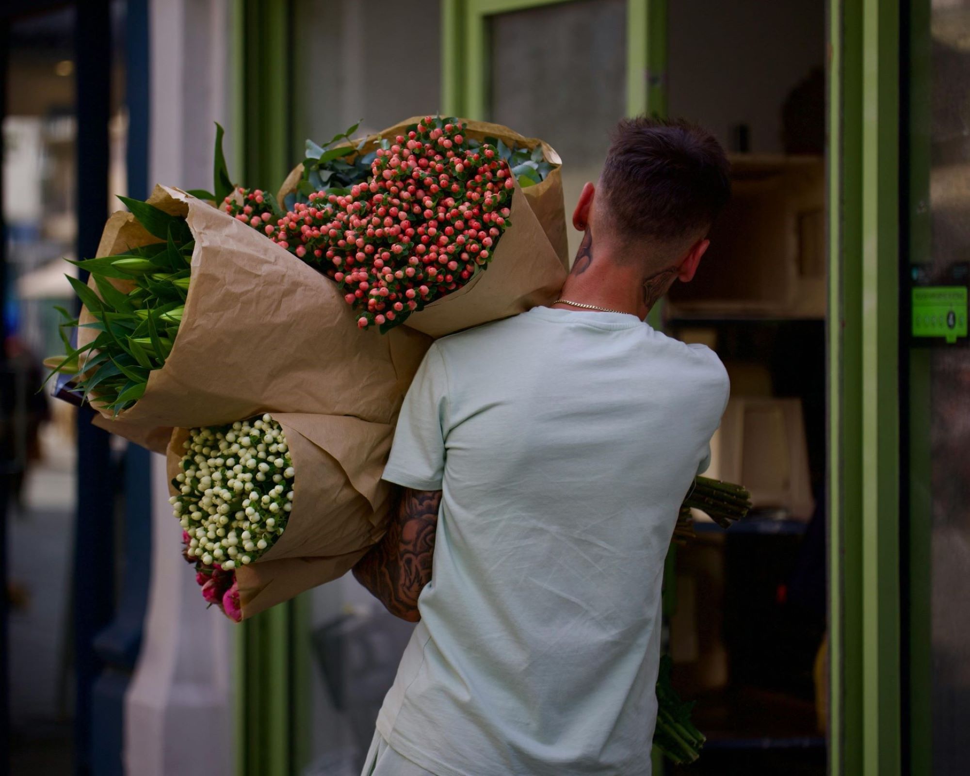 Man carrying flowers - Stephen Noulton, Pexels
